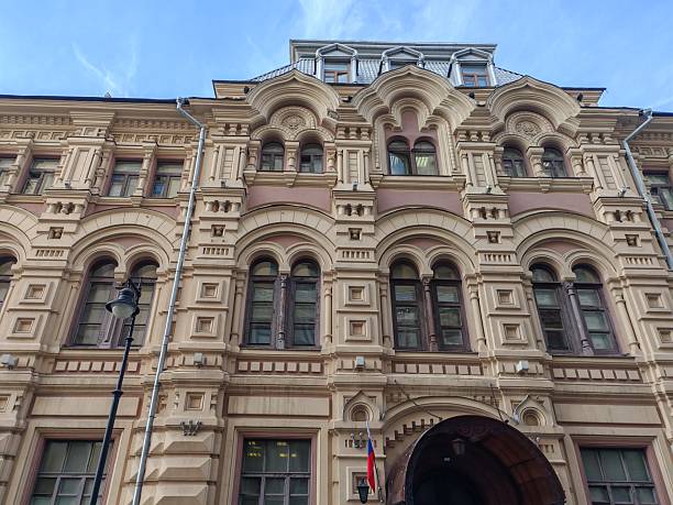 istock Low-angle view of a vintage architectural marvel featuring arched windows and rich detailing. The imposing facade draws attention to themes of legacy, hidden tales, and urban evolution. 2233363202
