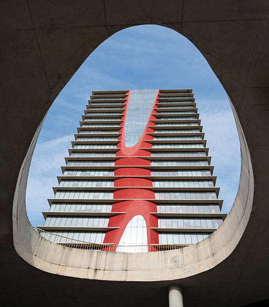 Residential building, an example of modern architecture. The building is characterized by its red facade and geometric design