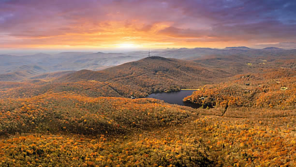 istock Fall forest on Appalachian mountain hills at sunset with brightly illuminated lush and pine woods. Autumnal landscape of beautiful nature 2233370269