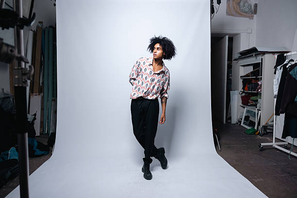 istock Classic Studio Shot of Man Facing on a side, Grey Background 2233371475