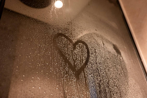 istock A heart is drawn on a window with water droplets on it 2233373409