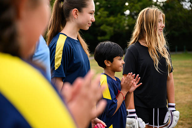 istock Girl with hands ready for catching ball during training with teammates 2233374701