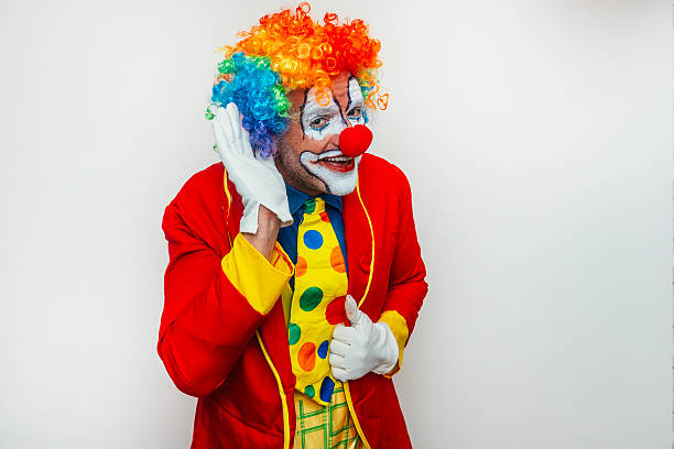 istock Clown listening with hand to ear 2233375057