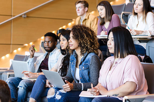 istock Diverse Group of Students Attentively Listening in Lecture Hall 2233376513