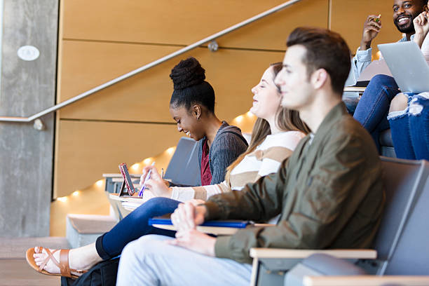 istock Diverse College Students Attentively Listening in Lecture Hall 2233376521
