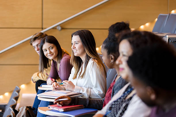 istock Diverse Group of Students Attentively Listening in Classroom 2233376546