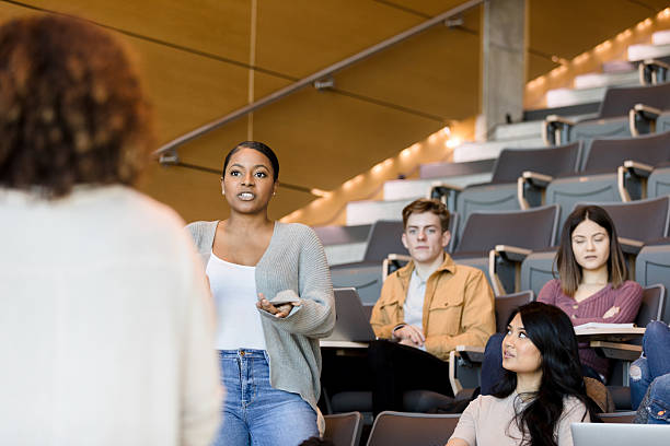 istock Young Woman Student Giving Presentation in Classroom 2233376605