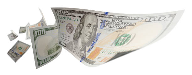 istock Randomly Falling U.S. 100 Dollar Bills Isolated on a White Background. 2233378412