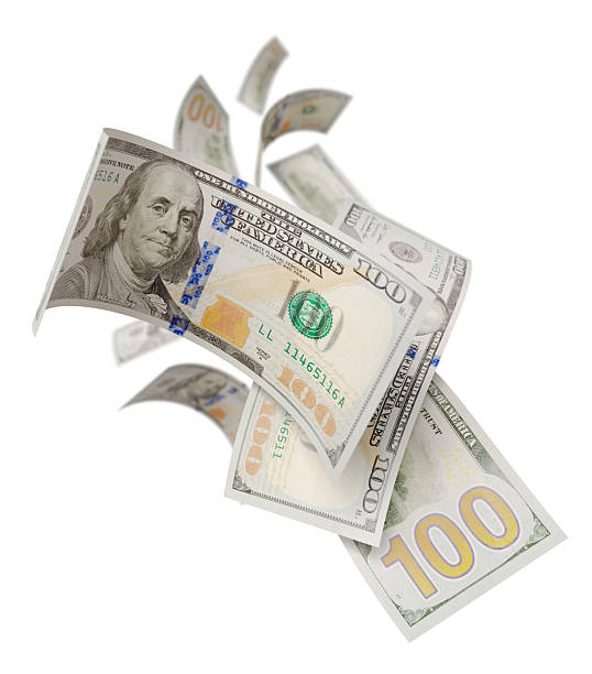 istock Randomly Falling U.S. 100 Dollar Bills Isolated on a White Background. 2233378436