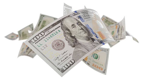 istock Randomly Falling U.S. 100 Dollar Bills Isolated on a White Background. 2233378506