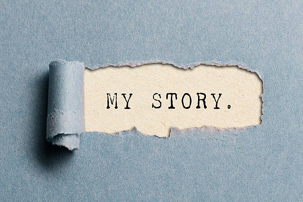 istock My story written under torn paper. Success concept. 2233378753