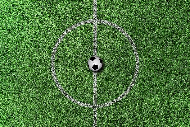 istock Soccer field center and ball top view background 2233378850