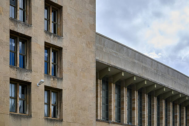 Berlin institutional building facade with large windows, daylight, vertical composition, urban minimalist style, suitable for architecture, editorial, real estate or city lifestyle commercial content.