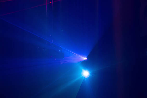 The illuminated by vivid blue and purple lights, creating a dynamic and immersive visual environment. The lighting setup suggests a high-tech, futuristic aesthetic, often used in concerts, electronic dance events, or multimedia art installations.