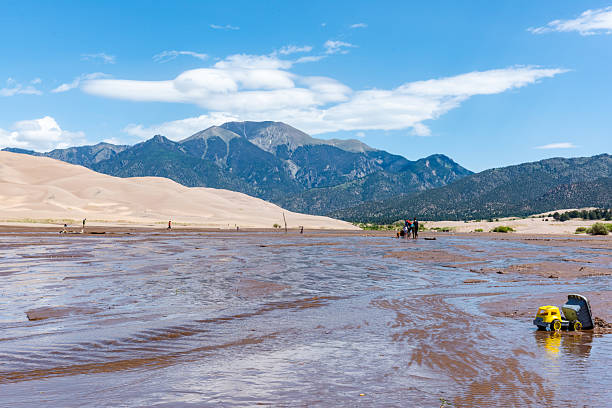 Tourists are playing in Great Sand Dunes National Park, Colorado, USA.