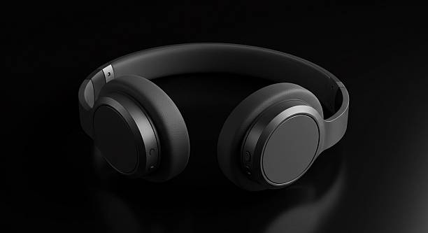 istock Sleek black wireless headphones on reflective surface. 2233383131
