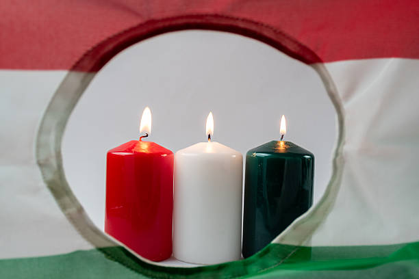 istock Hungarian flag with burning candles 2233383450