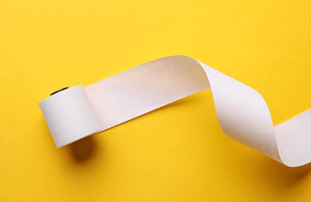 istock Cash register empty white tape roll on yellow background 2233386385