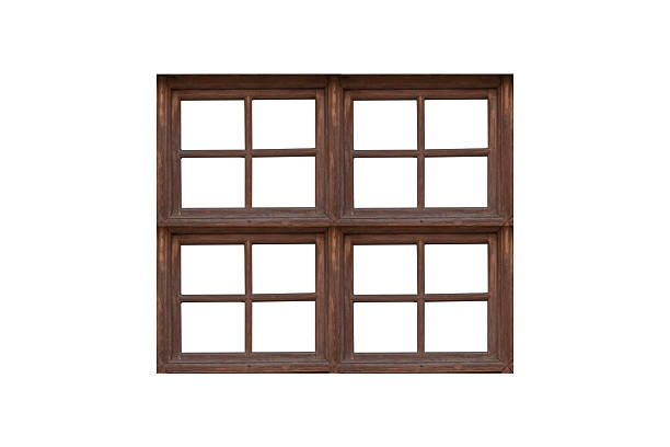 istock Vintage wooden window frame with four sections with bars is isolated. 2233386768