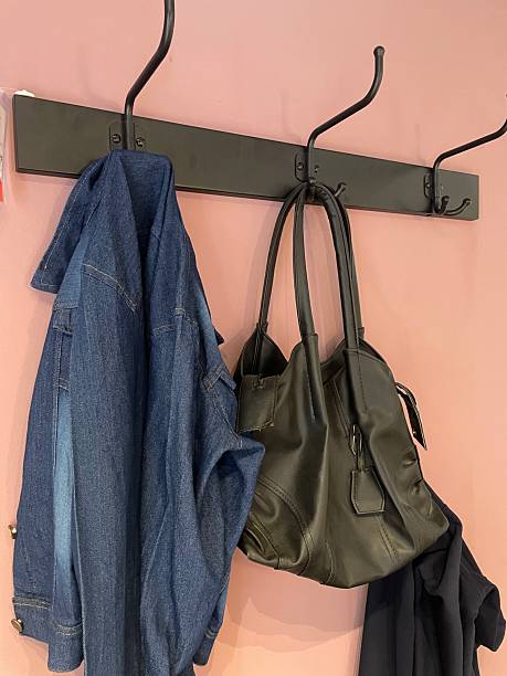 istock Wall-Mounted Coat Rack with Hanging Bag and Denim Jacket 2233387142