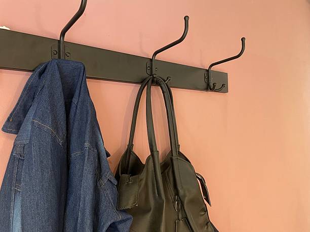istock Wall-Mounted Coat Rack with Hanging Bag and Denim Jacket 2233387734
