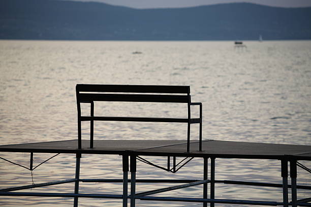 Fishing pier with bench on lake Balaton