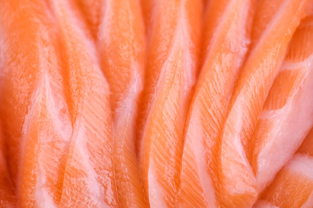 Fresh, juicy salmon cut into pieces for sashimi
