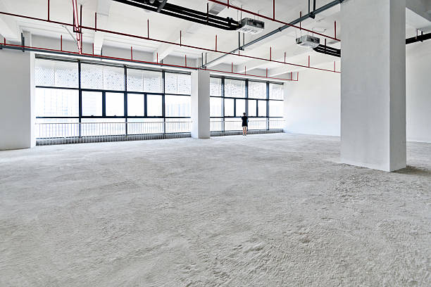 istock Woman standing in new office building 2233391420
