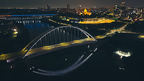 istock Illuminated modern bridge over river at night, aerial drone view, Edmonton 2233391511