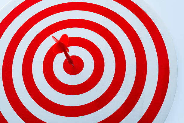 Dart arrow on center of dartboard.