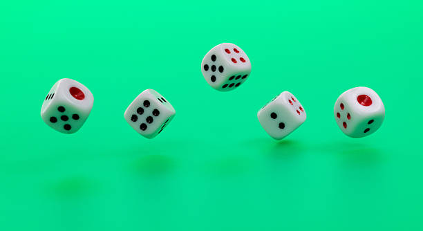 istock Group of dices on green background 2233391781