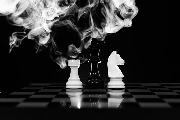 istock Three chess pieces in fog on black background 2233391938