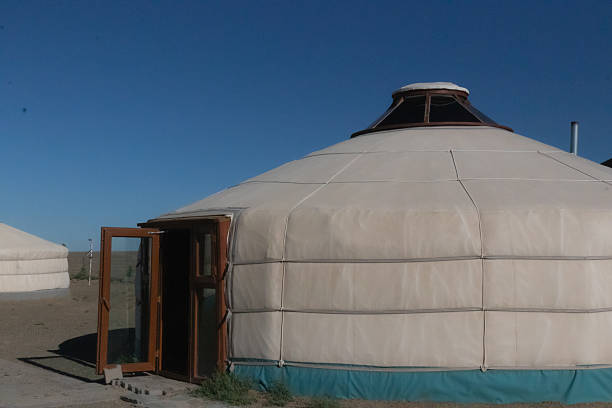 A collection of stunning photographs showcasing the vast and diverse landscape of the Mongolian Gobi Desert. The images capture the serene beauty of the region, featuring traditional yurts (gers) used by nomadic people, sprawling green steppes, and majestic sand dunes under a clear blue sky. These photos are ideal for projects related to travel, nature, adventure, cultural heritage, and remote landscapes.