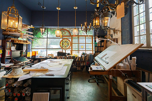 istock Wide Angle View of an Inviting Open-Plan Design Studio with a Countertop, Drafting Table, and Digital Design Station in an Antique Restoration and Architecture Shop 2233400893