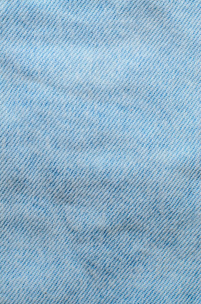 istock Light blue denim fabric textile background with soft texture for modern fashion design and casual clothing concepts 2233402671
