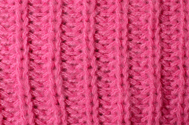 istock Knitted pink wool fabric texture used as soft textile background for modern fashion design and cozy interior decoration concepts 2233402832