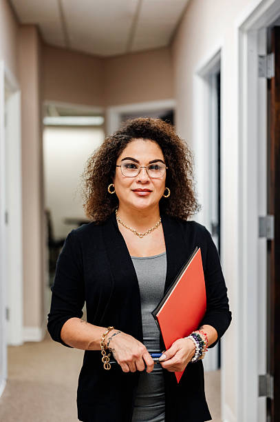 istock Professional middle age Latina woman working in an office 2233404273