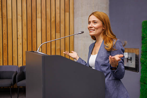 istock Businesswoman giving a speech at a conference 2233407447