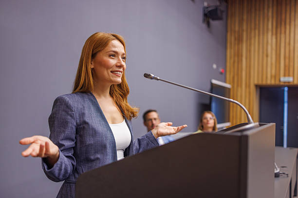 istock Motivational speaker inspiring audience with her presentation 2233407449