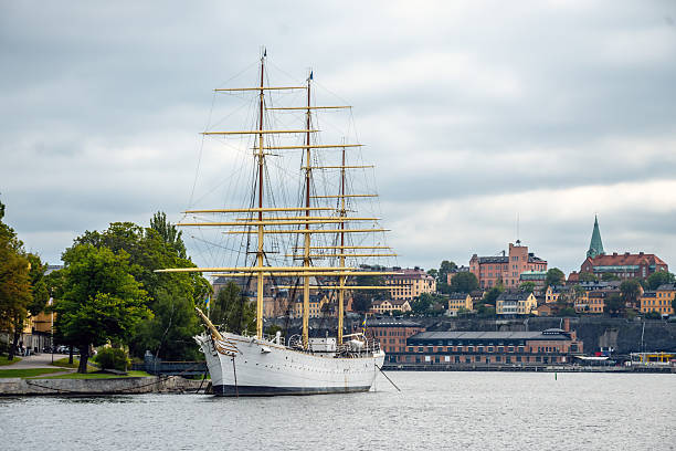 The vintage steamship SS Stockholm, of the Strömma line, on a short voyage within the Swedish archipelago on an intermittently sunny and cloudy day in summer.