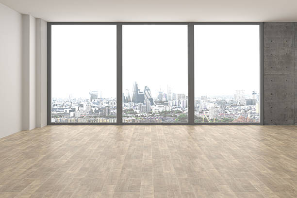 istock Large hall with large windows and city view. Empty room 2233409097