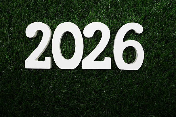 istock 2026 Happy New Year Flat lay on Green artificial grass 2233412032