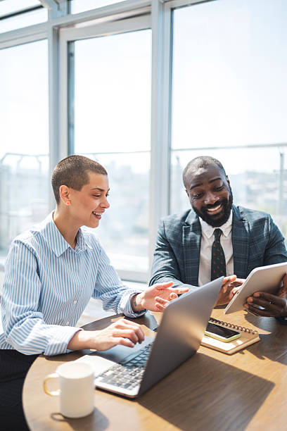 istock Collaborative discussion between colleagues in a modern and bright office environment 2233415688