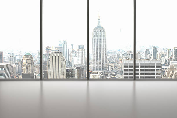 istock Large hall with large windows and city view. Empty room 2233418715