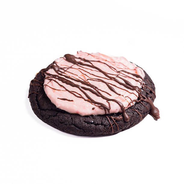 istock Cookie - Chocolate Drizzled Pink Strawberry Cookie 2233424352