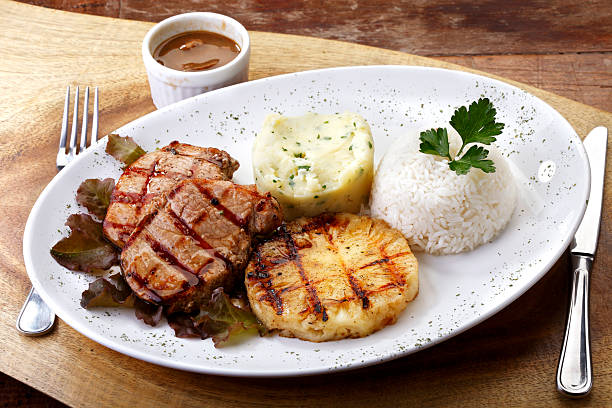 Grilled steak, rice, salad and garnish