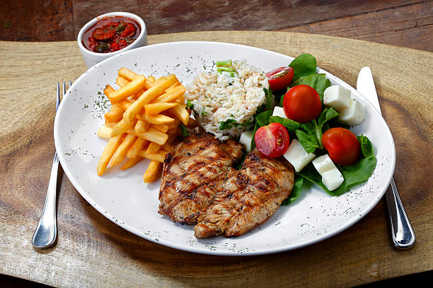 Grilled steak, rice, salad and garnish