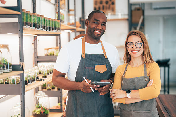 istock Young business owners checking inventory on store shelves using a digital tablet 2233428251
