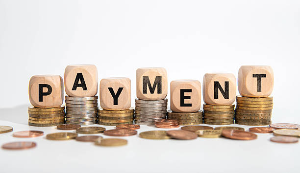 istock PAYMENT TERMS word on the yellow paper with office tools on the white background 2233430390
