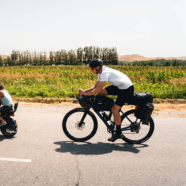 istock Bikepacker rides roads in Samarkand 2233432696